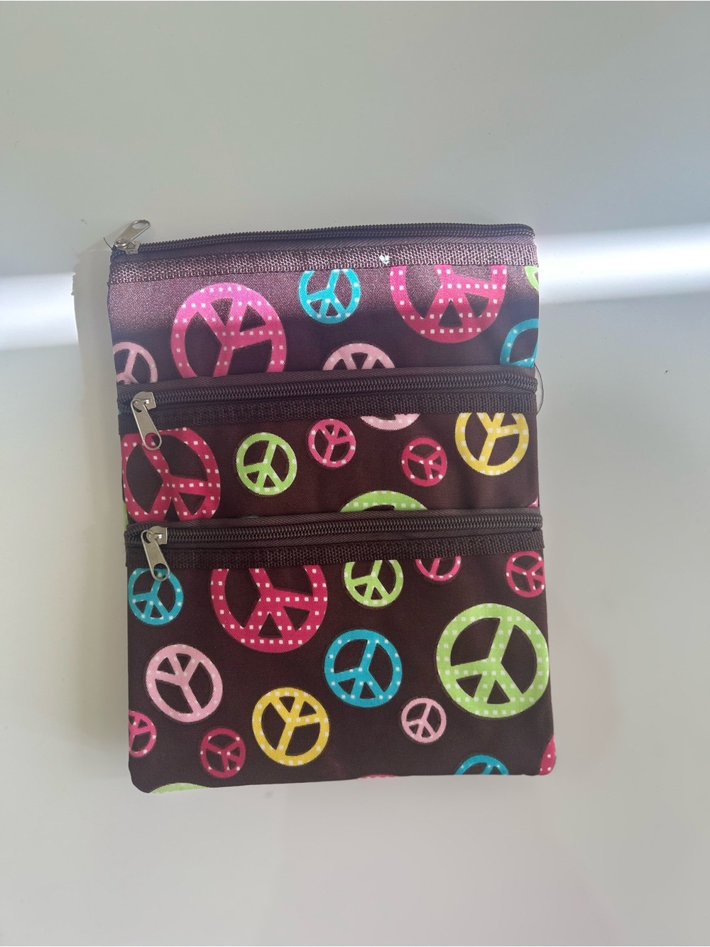 Compact Brown Crossbody Bag with Colorful Peace Sign Print
